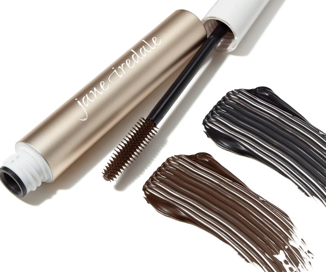 Lash Fixation Length & Definition Tubing Mascara tube with black and brown mascara swatches