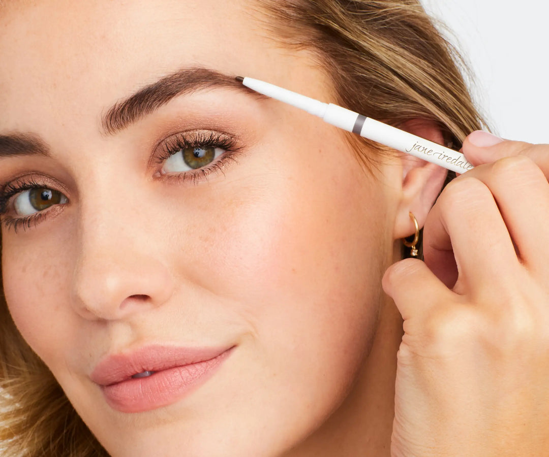 Jane Iredale model using the Precision Brow Pencil to fill in her brows