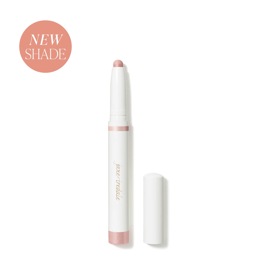 Jane Iredale® ColorLuxe Eye Shadow Stick in Prima, shown uncapped in a white stick format with a light pink shimmer shade.