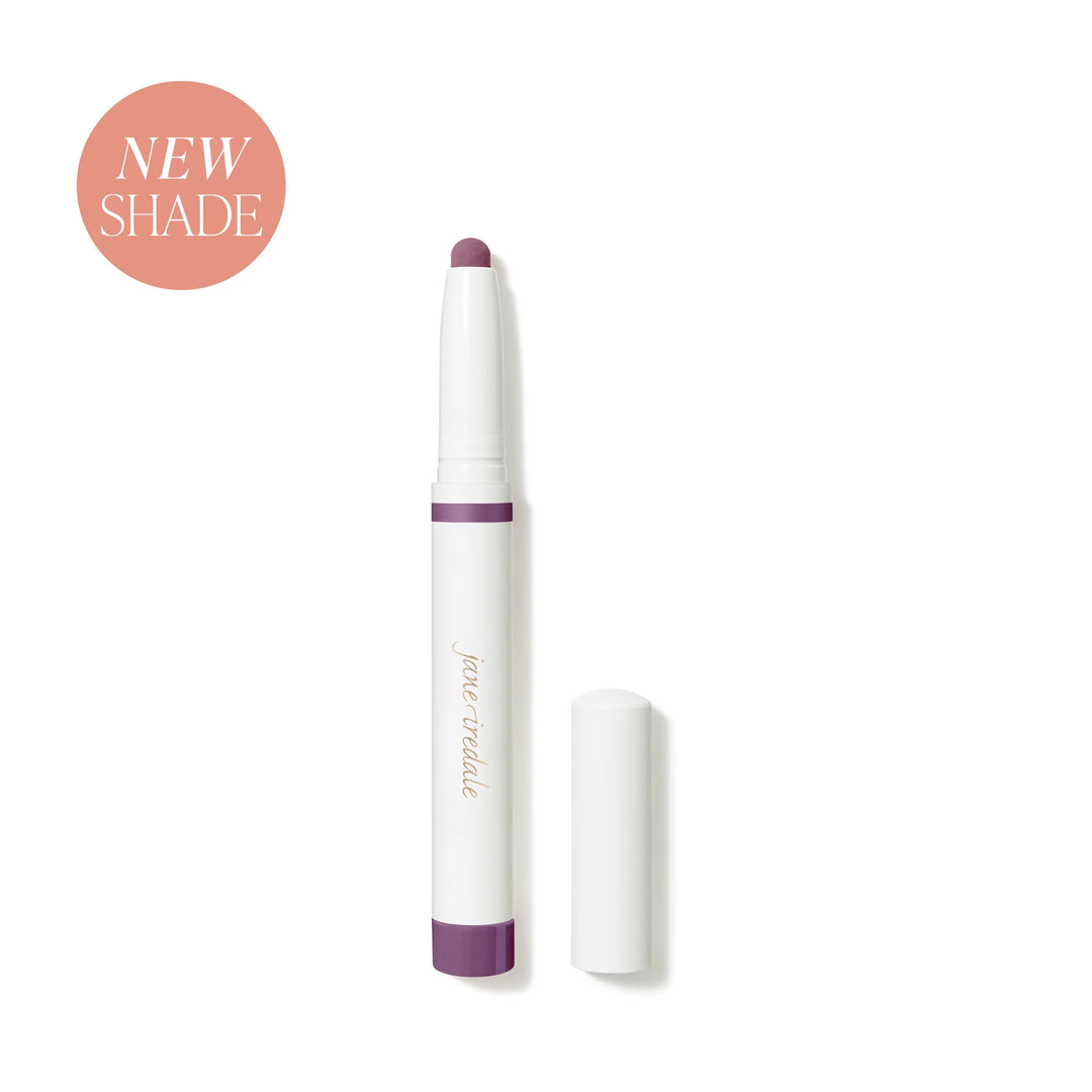 Jane Iredale® ColorLuxe Eye Shadow Stick in Provence, shown uncapped in a white stick format with a matte purple shade.