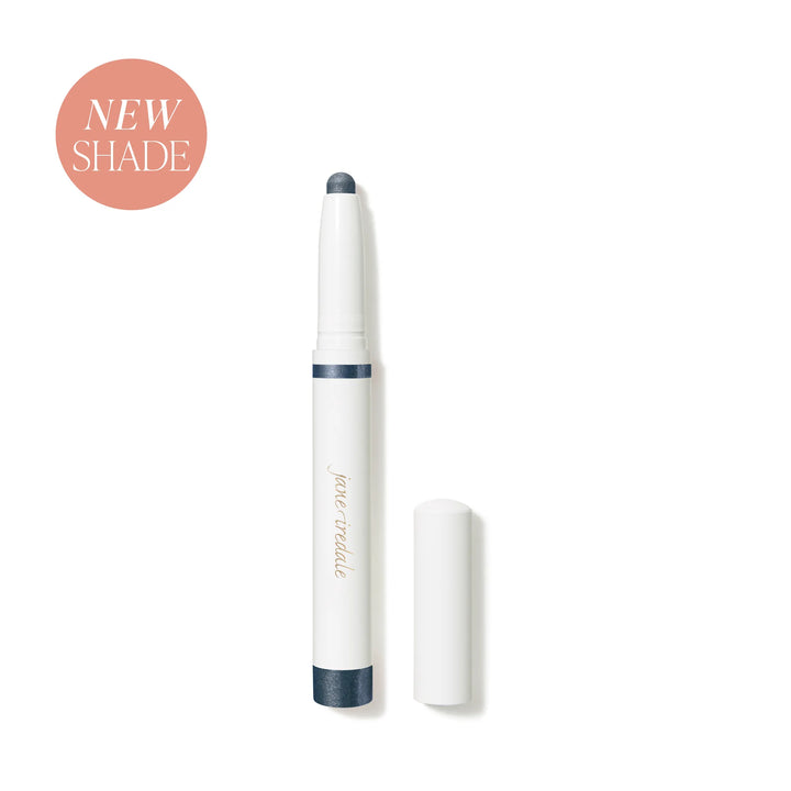 Jane Iredale® ColorLuxe Eye Shadow Stick in Riviera, shown uncapped in a white stick format with a deep shimmering blue shade.