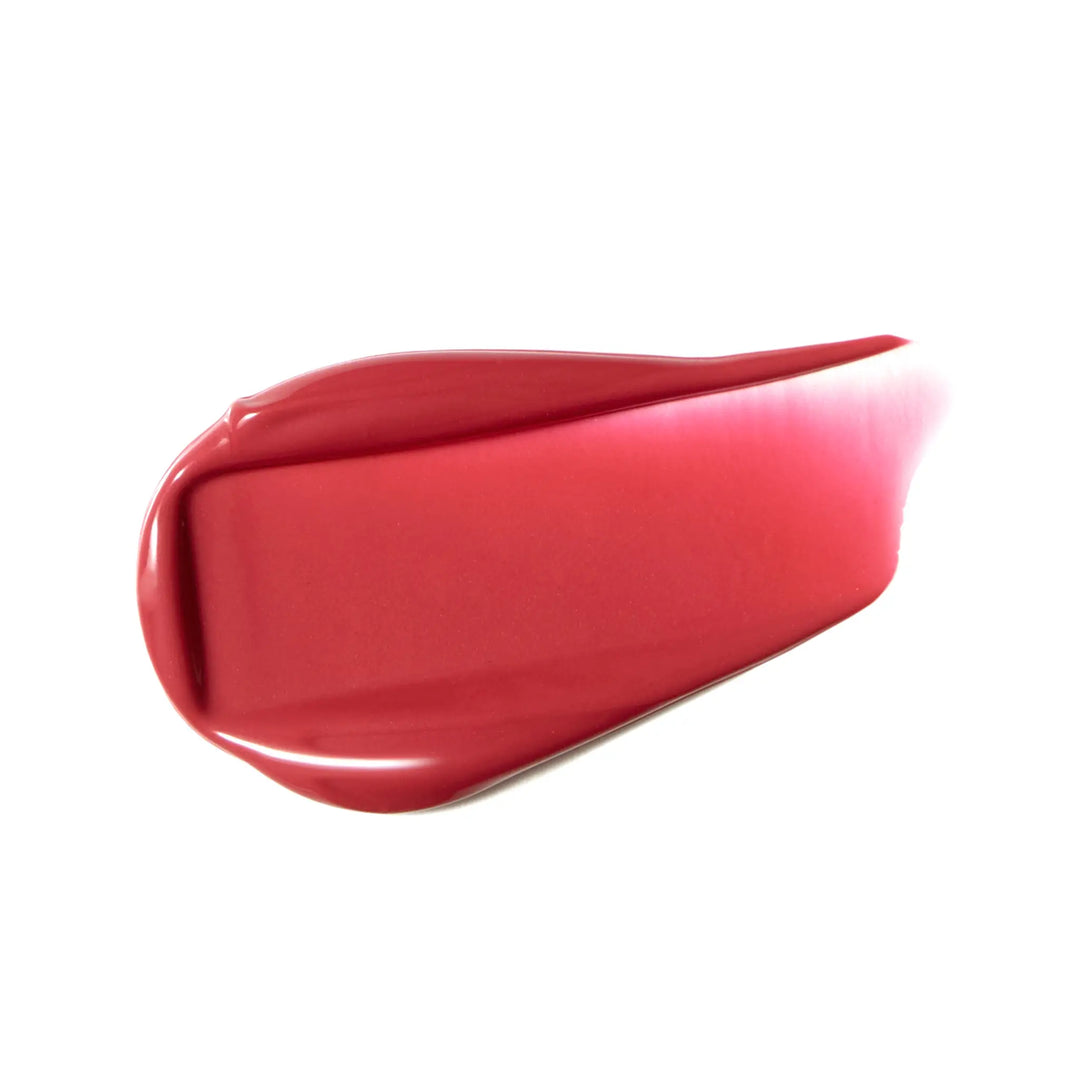 Vivid pink red coloured liquid blush swatch on white background