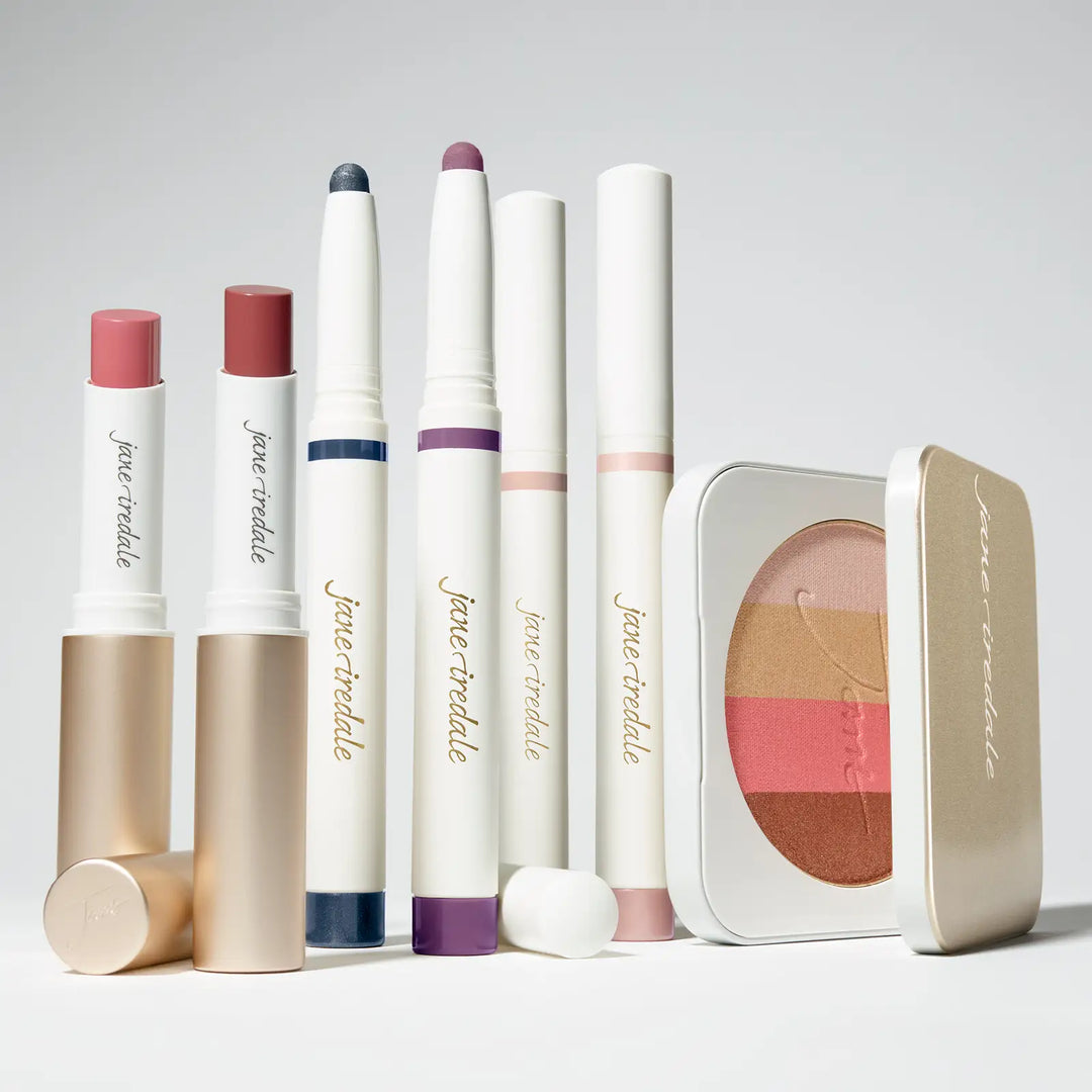 The Autumn Edit, a collection of Jane Iredale makeup products including new eye shadow stick shades, lipsticks and a bronzer palette on a light gray background.