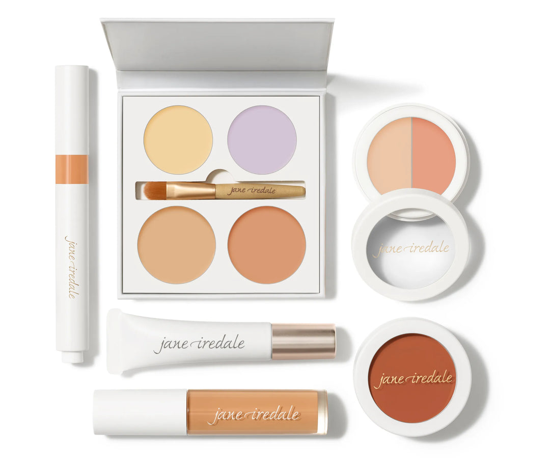 Set of Jane Iredale concealer makeup products on a white background.